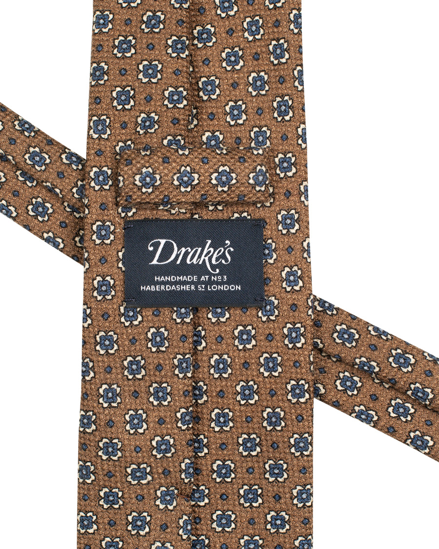 Herre | Drake's Wool/Silk/Cashmere Printed Flower 8 cm Tie Brown | Drake's | Wool/Silk/Cashmere Printed Flower 8 cm Tie Brown