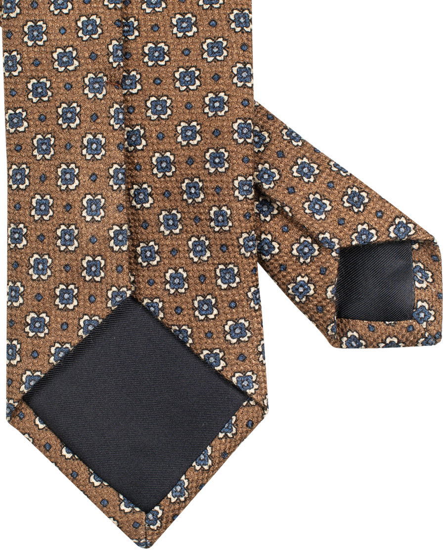 Herre | Drake's Wool/Silk/Cashmere Printed Flower 8 cm Tie Brown | Drake's | Wool/Silk/Cashmere Printed Flower 8 cm Tie Brown
