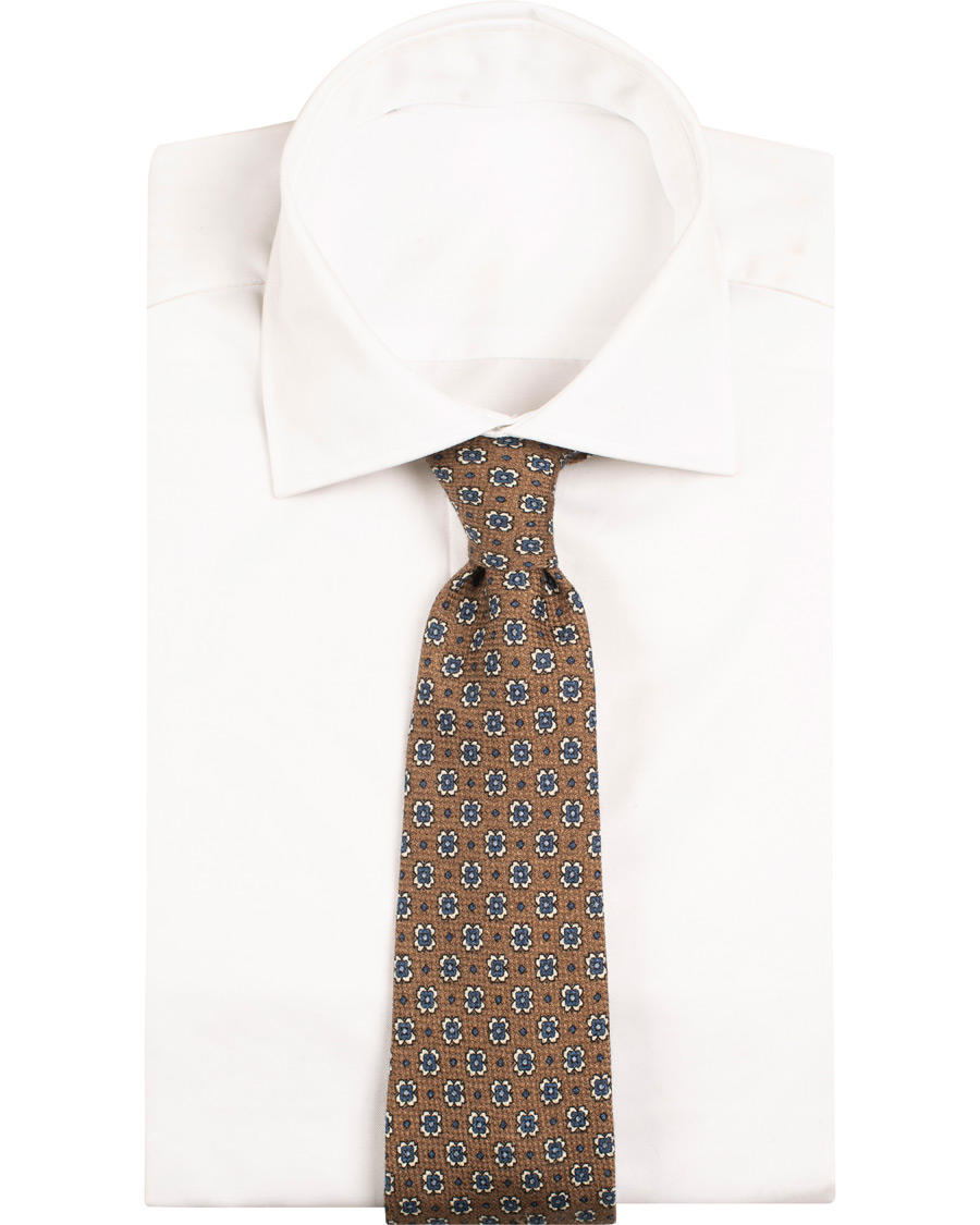 Herre | Drake's Wool/Silk/Cashmere Printed Flower 8 cm Tie Brown | Drake's | Wool/Silk/Cashmere Printed Flower 8 cm Tie Brown