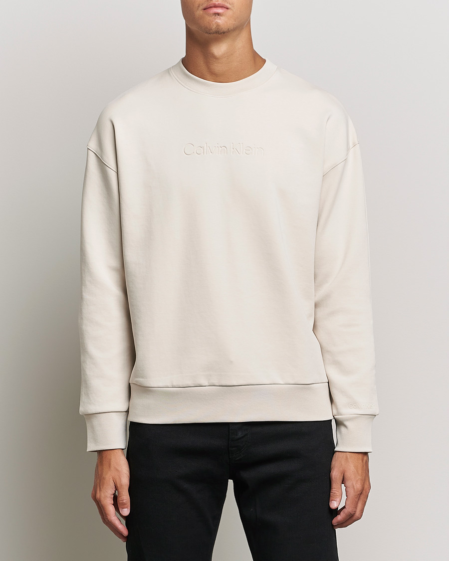 Herre |  | Calvin Klein | Debossed Logo Crew Neck Sweatshirt Stony Beige