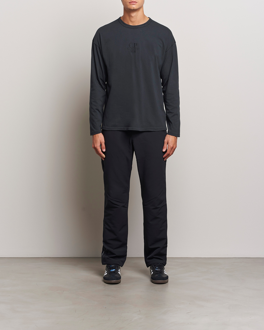 Herre | T-Shirts | C.P. Company | Box Fit Tonal Logo Long Sleeve T-shirt Washed Black
