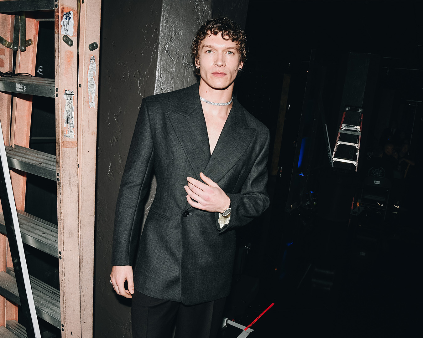 Connor Storrie In Saint Laurent and Tiffany & Co. jewelry.